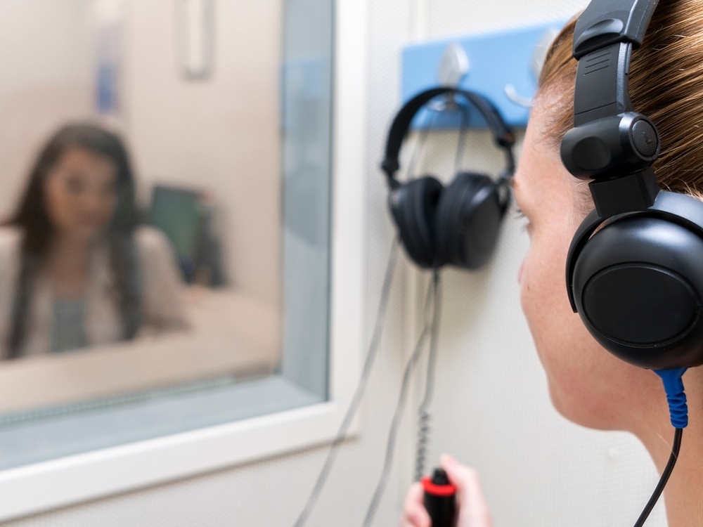 Doctor of Audiology conducting a hearing evaluation with a patient at Hear Today Hearing Aids in Corpus Christi, TX